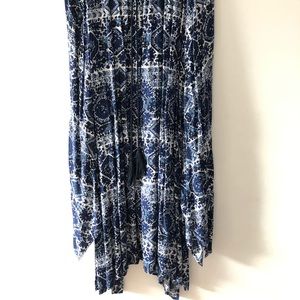 Long Pleated Skirt with Asymmetrical Hem